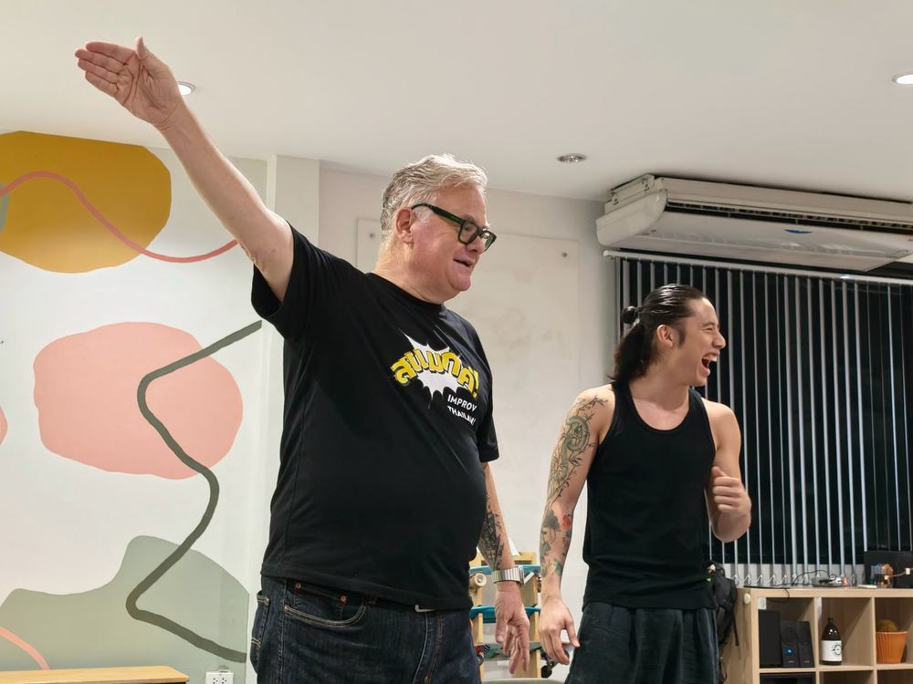 Curt and a participant laughing in an exercise